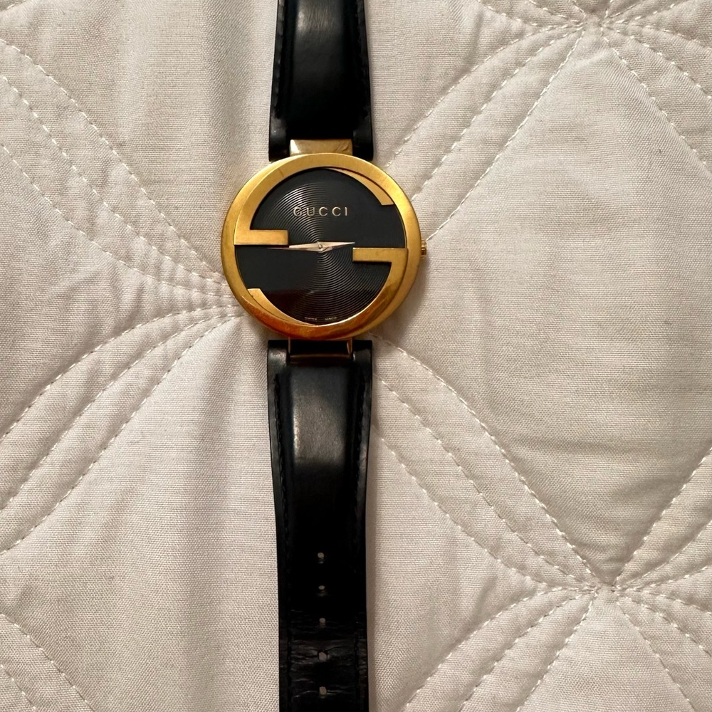 Gucci Black and Gold Timepiece